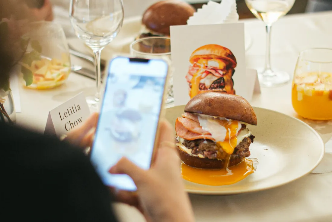 A plated course at an art dinner, with a small illustrated card showing the dish