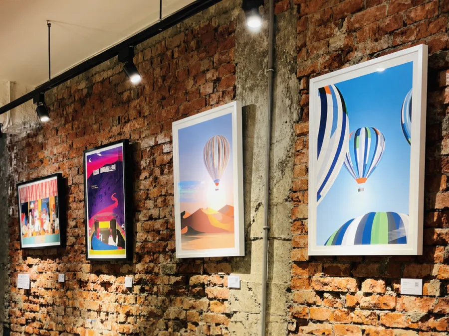Exhibition wall at THE STUDIO with framed art prints